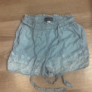 Francesca’s Blue Rain branded flowy tie shirts